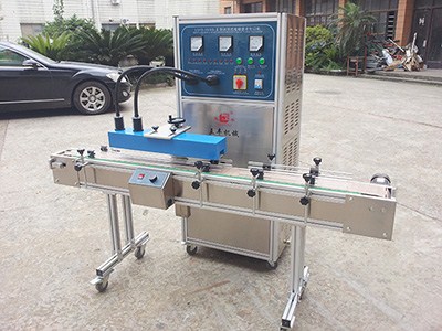 Automatic induction seal machine